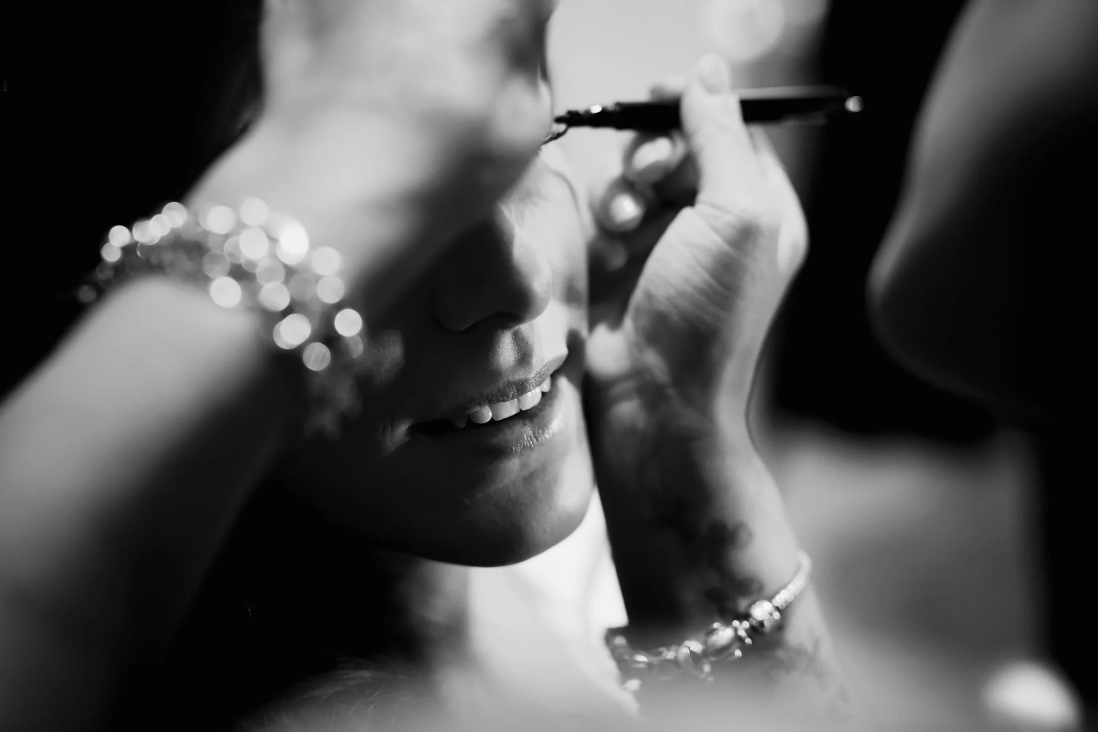 A close black-and-white portrait of a bride