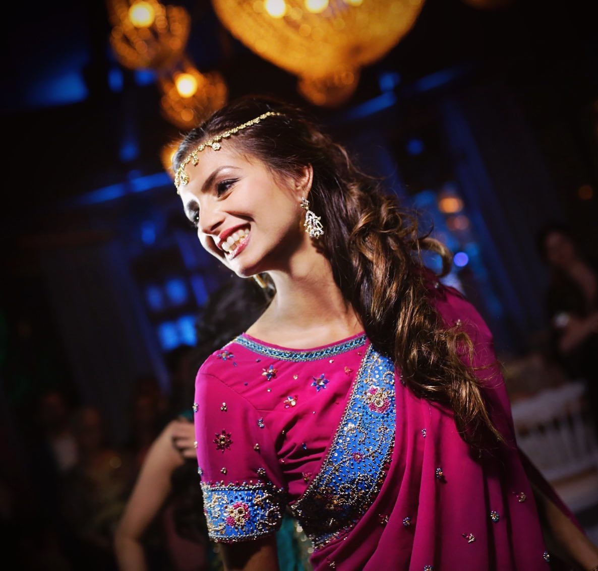 A guest in vivid dress at a Marrakech celebration