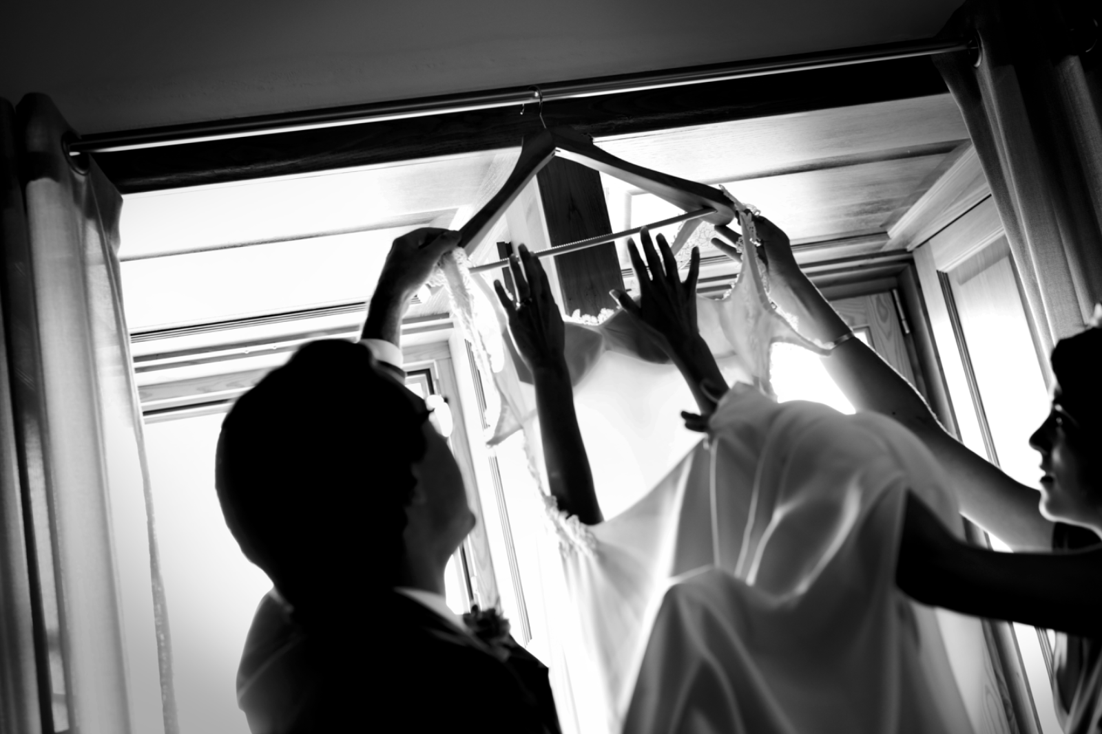 A bride and groom in a pale Parisian interior